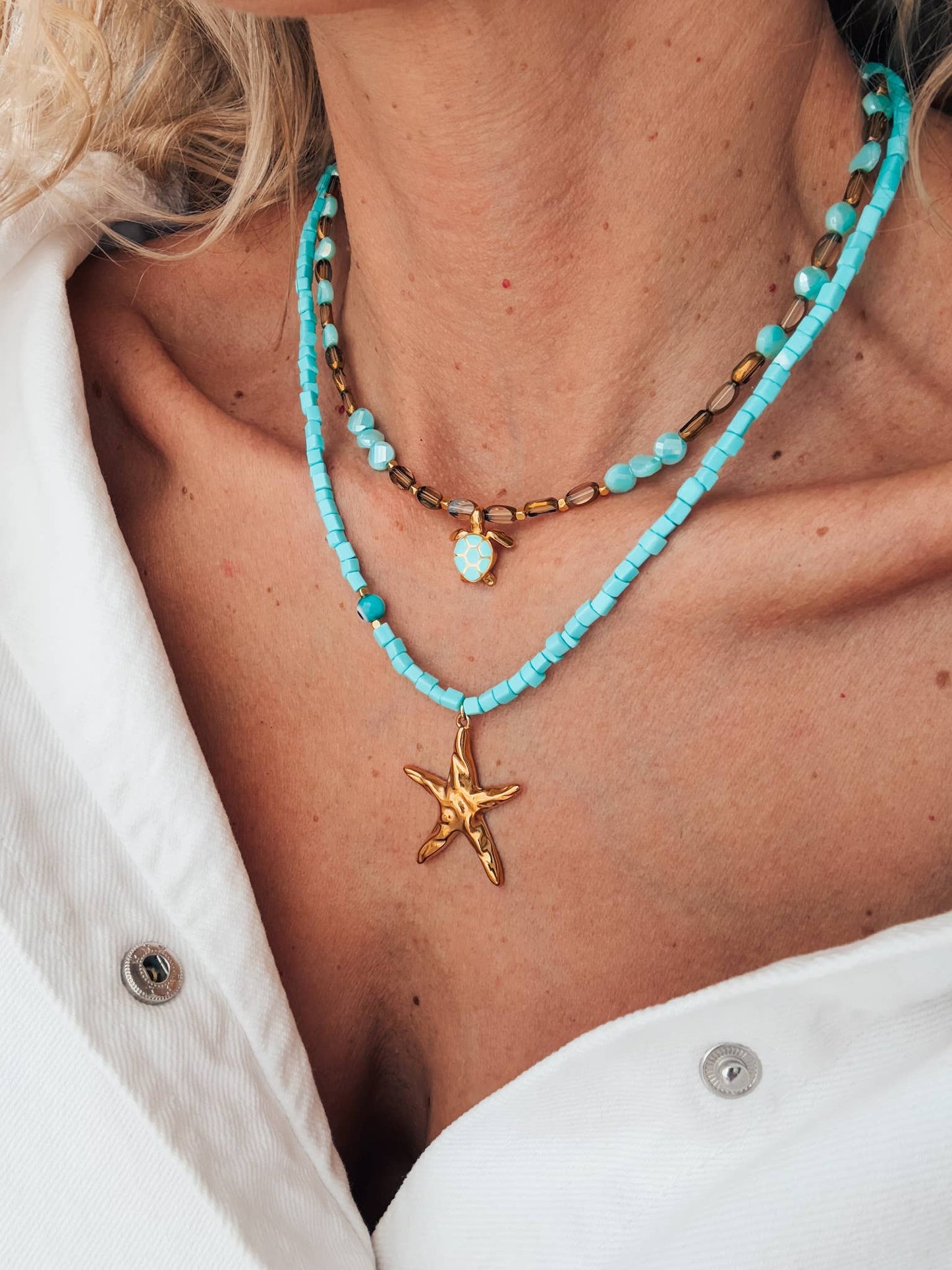 Beaded necklace with starfish and sea turtle gold charm: Starfish