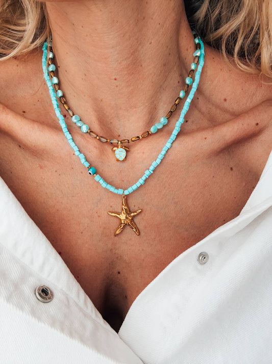 Beaded necklace with starfish and sea turtle gold charm: Starfish